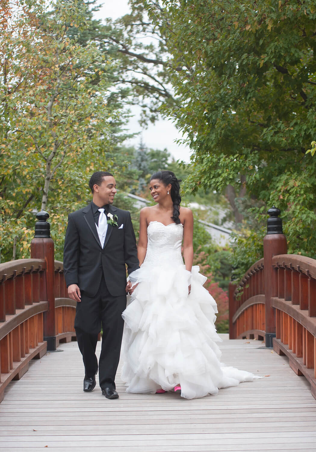 Anderson Japanese Gardens walking on bridge Rockford Wedding Photography