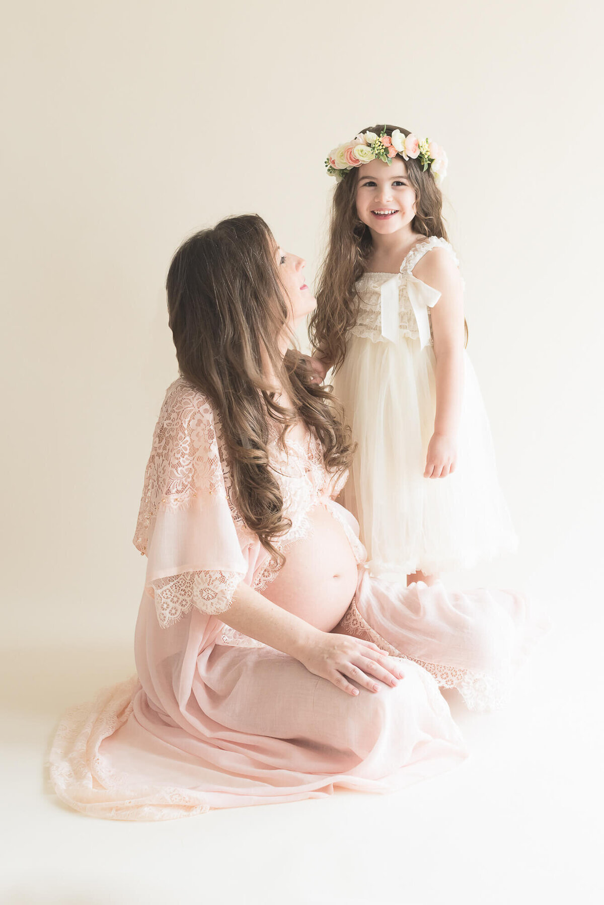 studio portrait mommy and me maternity session light and airy soft blush and cream  on cream studio backdrop captured by Allison Amores Photography