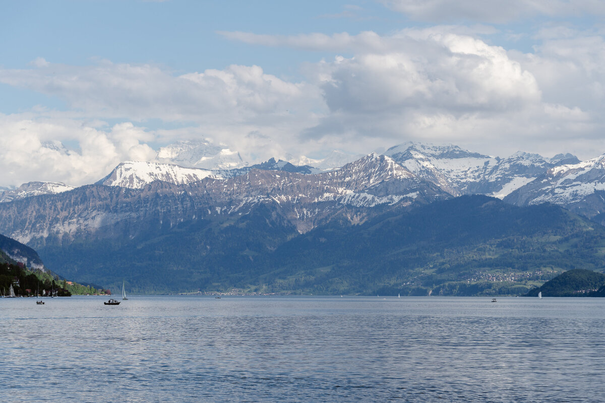 Snow capped mountains with a lake in front