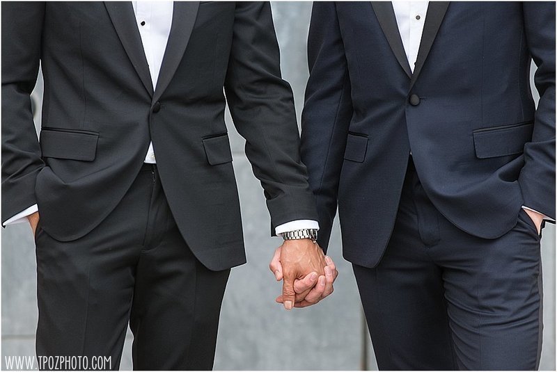 grooms holding hands