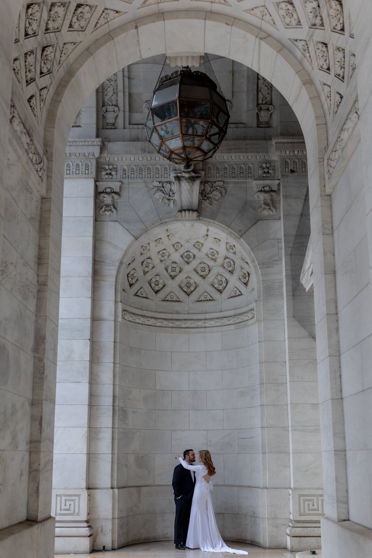 Bride and groom embracing in gorgeous NYC.