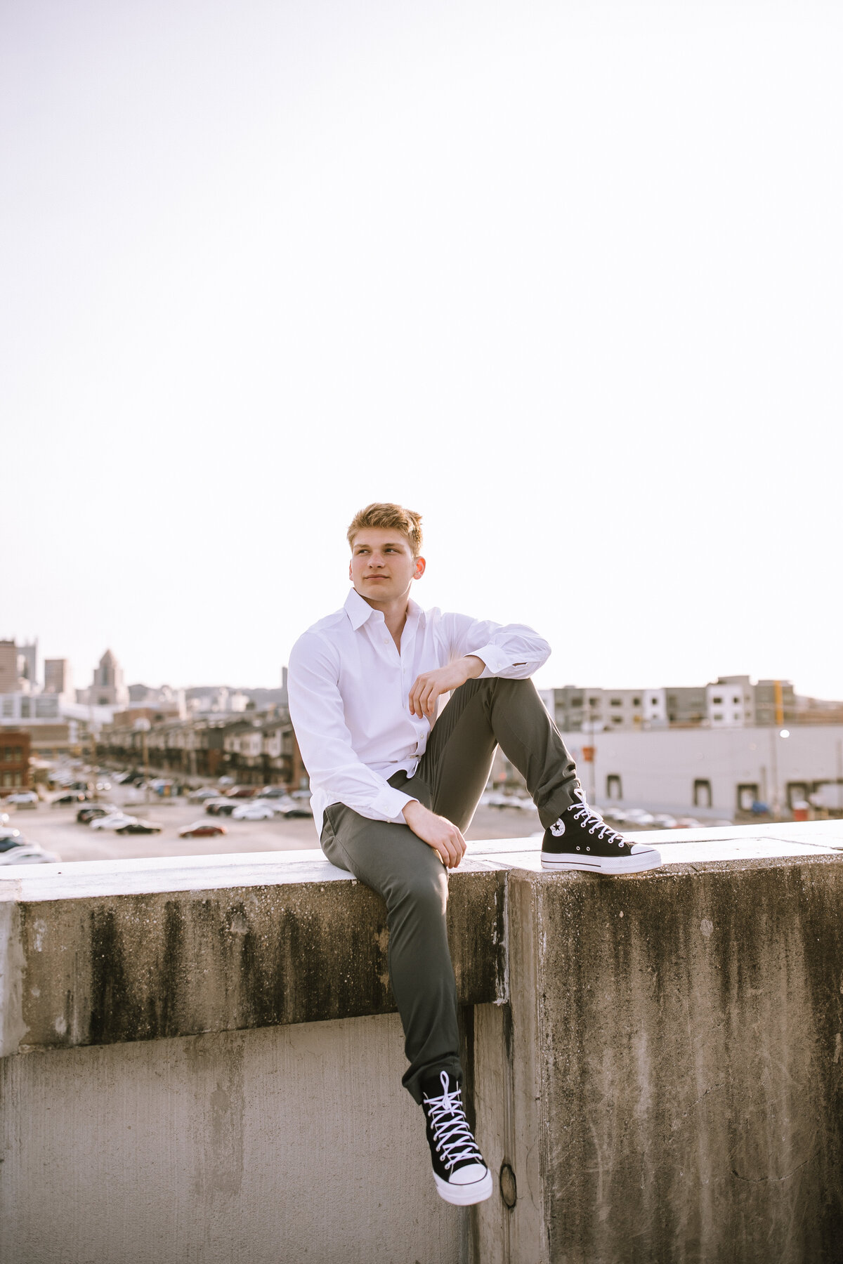 Senior boy on a rooftop in Pittsburgh. 