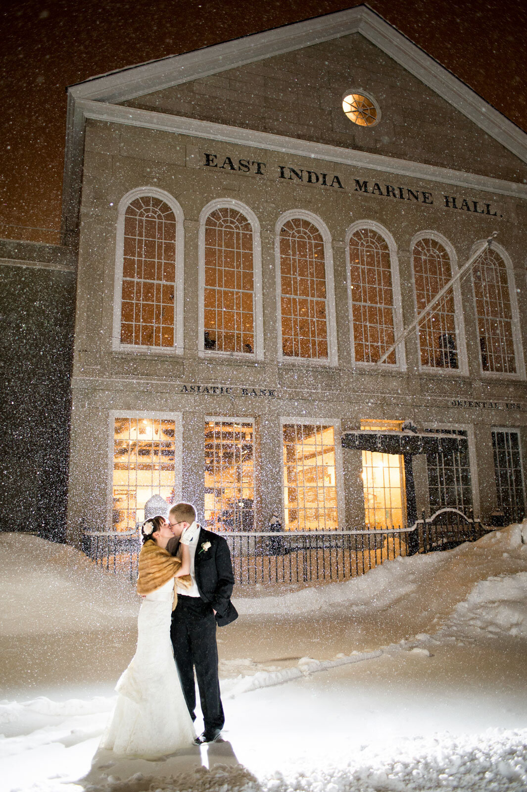 salem massachusetts snowy winter wedding bride and groom kissing