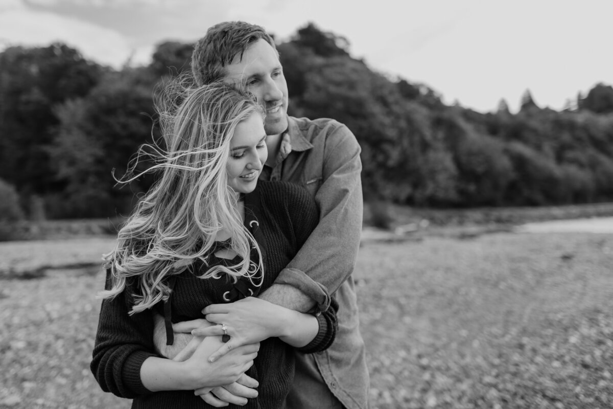 A sweet and cozy engagement session at a Seattle beach. Captured by Fort Worth wedding photographer, Megan Christine Studio