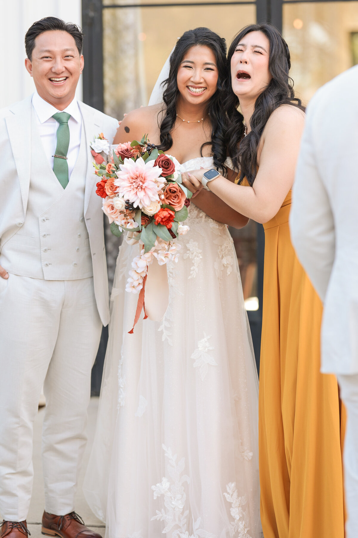 Fun candid portrait of bride & groom with friends at Barn South wedding. 