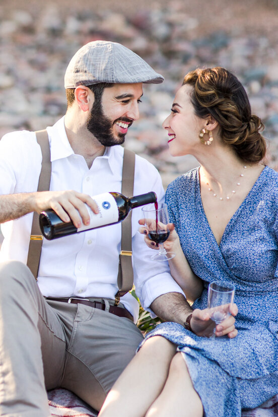 engaged-couple-drinking-wind