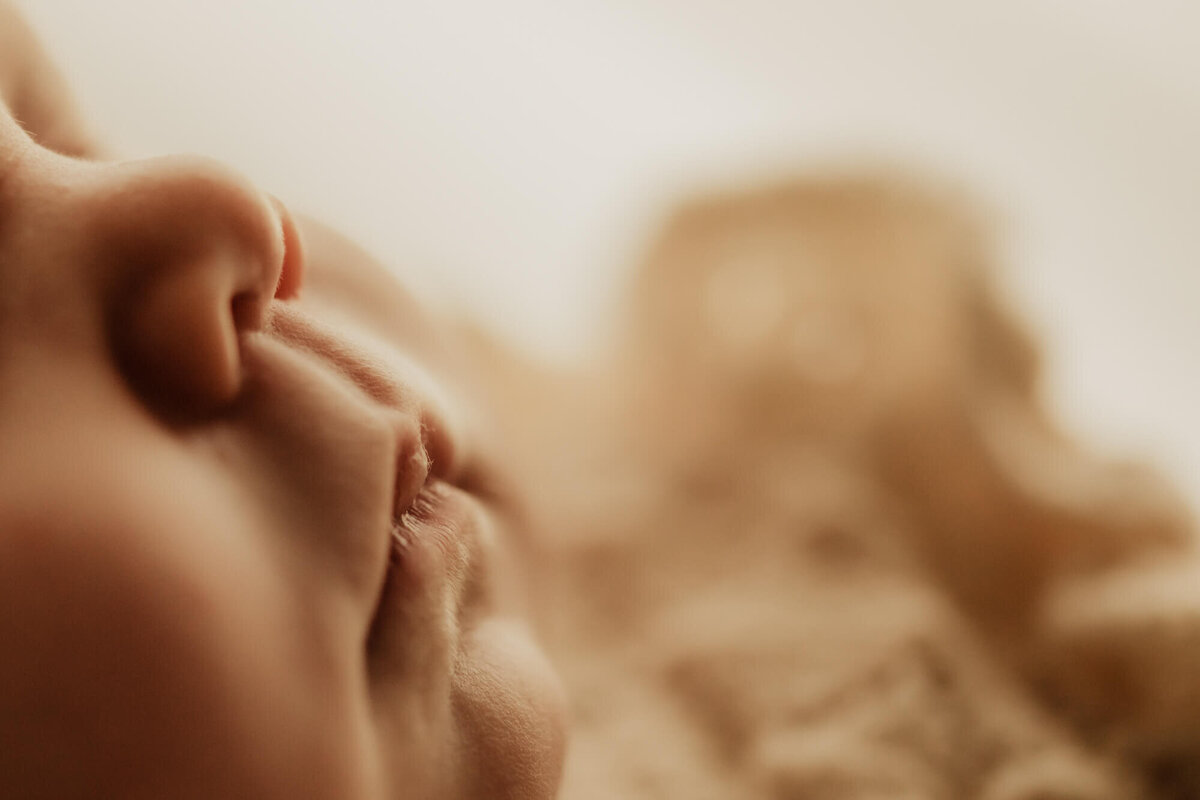 Newborn girl's lips and nose.
