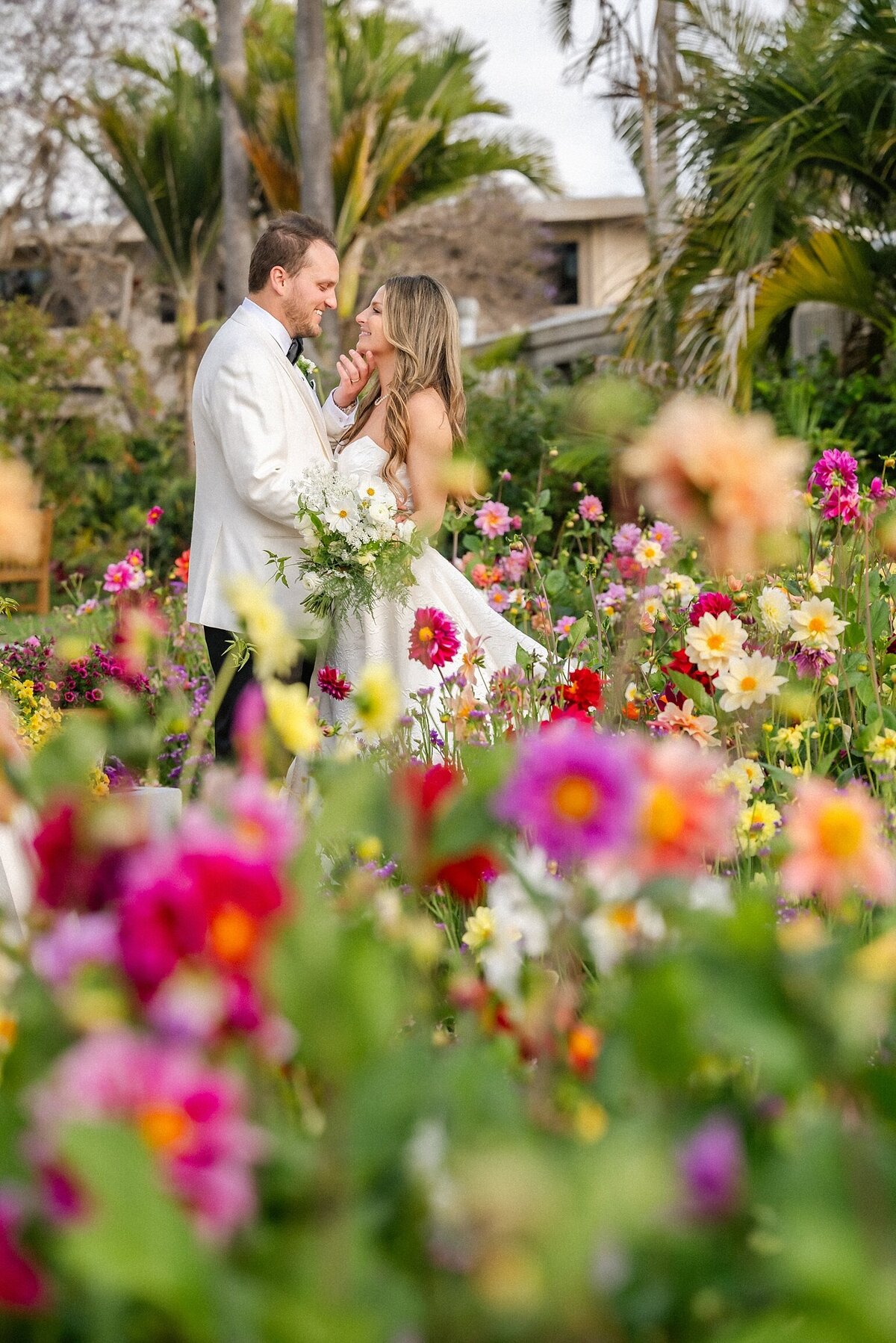 bride and groom in a flower field