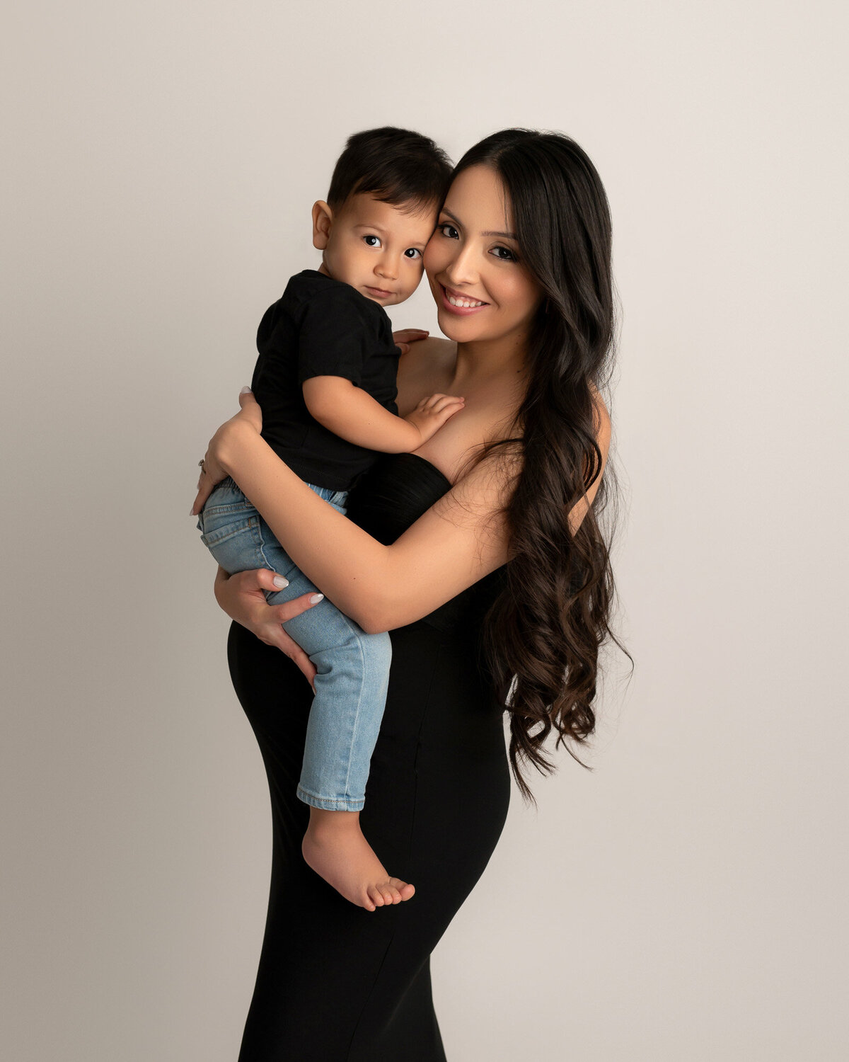 Lakeway maternity photographer captures mom with toddler portrait with professional studio lighting