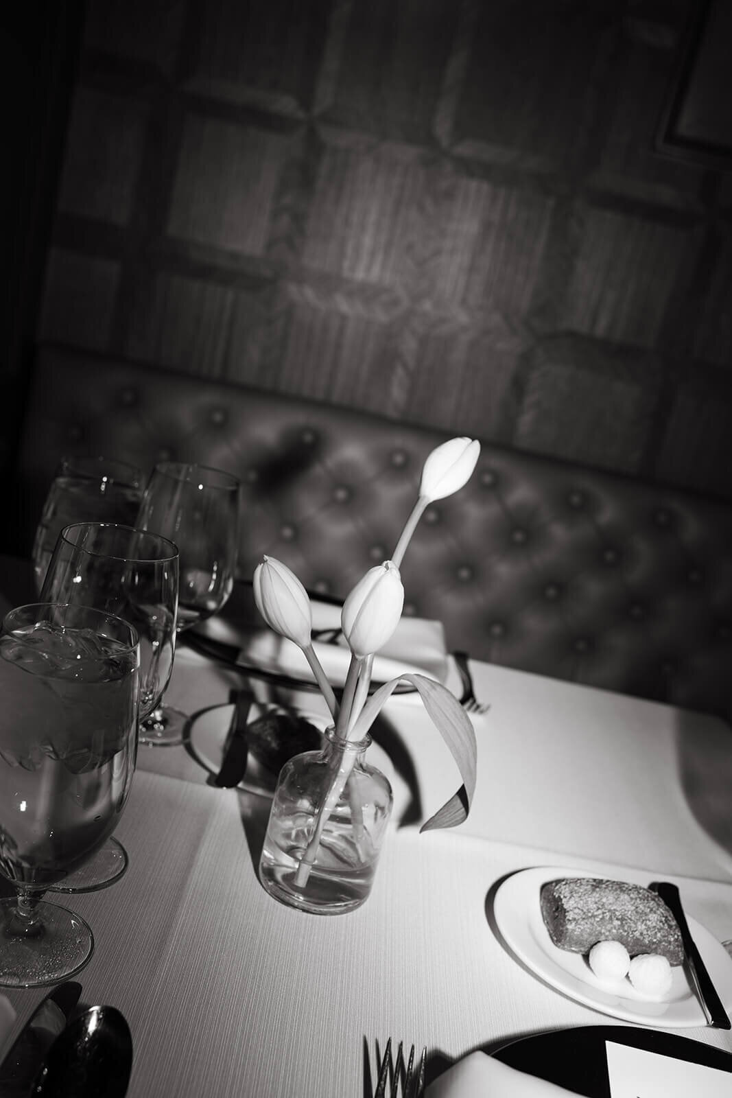 Wedding reception table at St. Regis Aspen with detailed floral arrangements, candlelight, and refined table settings.