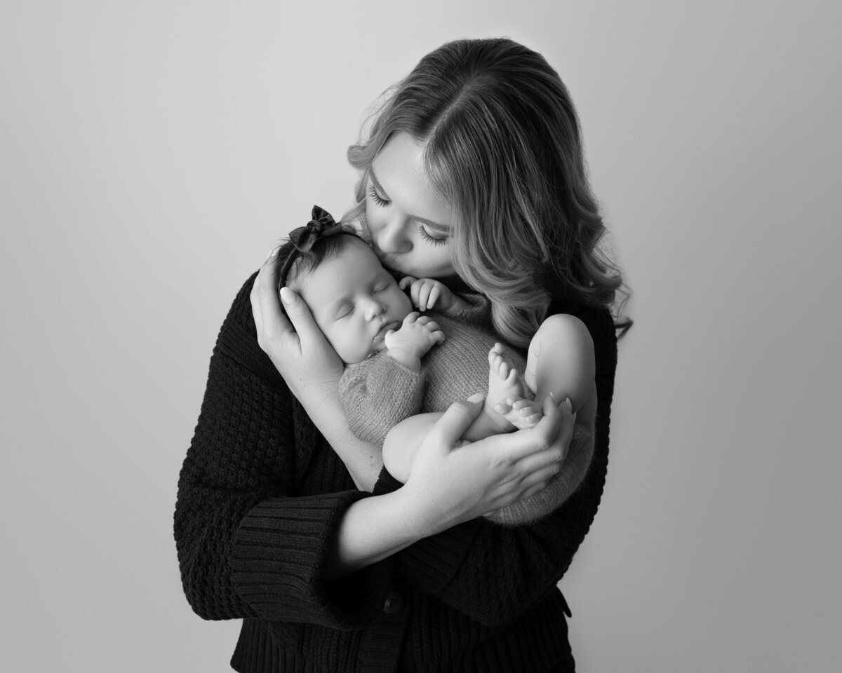Black white mother holding newborn intimate portrait Austin family photographer