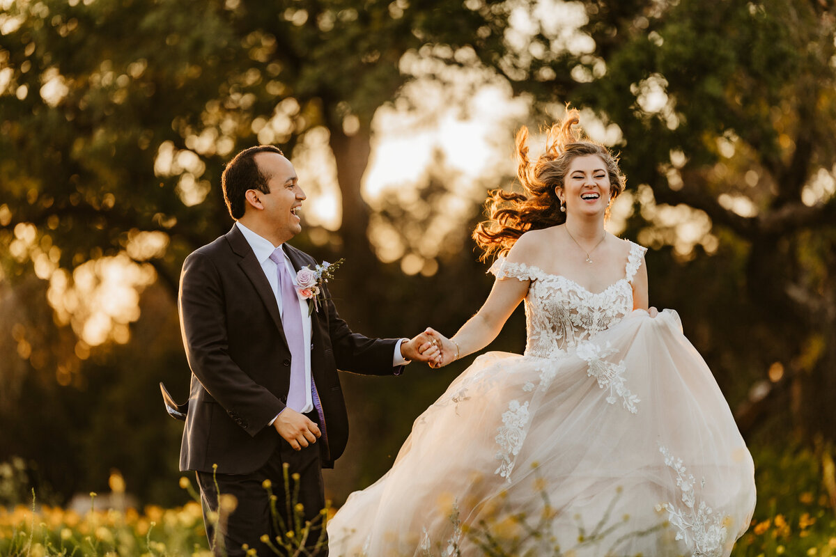 bride-and-groom-run-in-wildflowers
