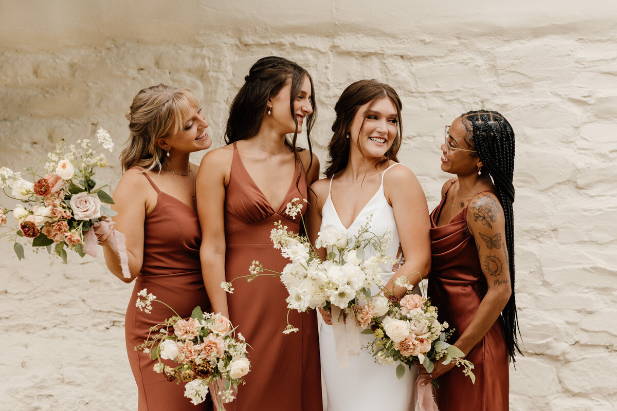 bridesmaids holding bouquets on wedding day