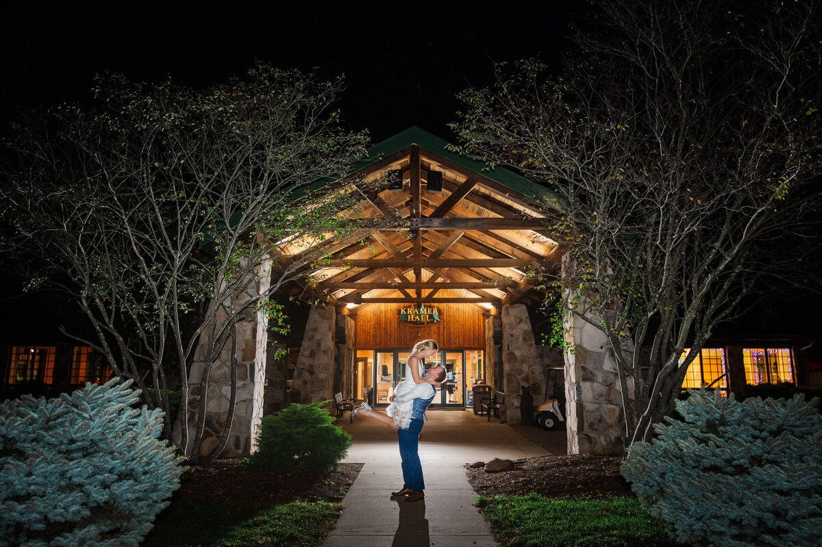night photo of a wedding couple at YMCA Camp Kon-O-Kwee kramer hall