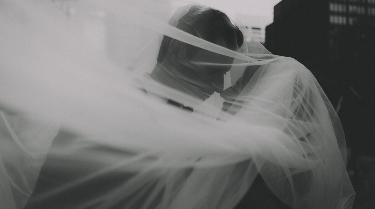 Wedding Couple under a veil in downtown Calgary