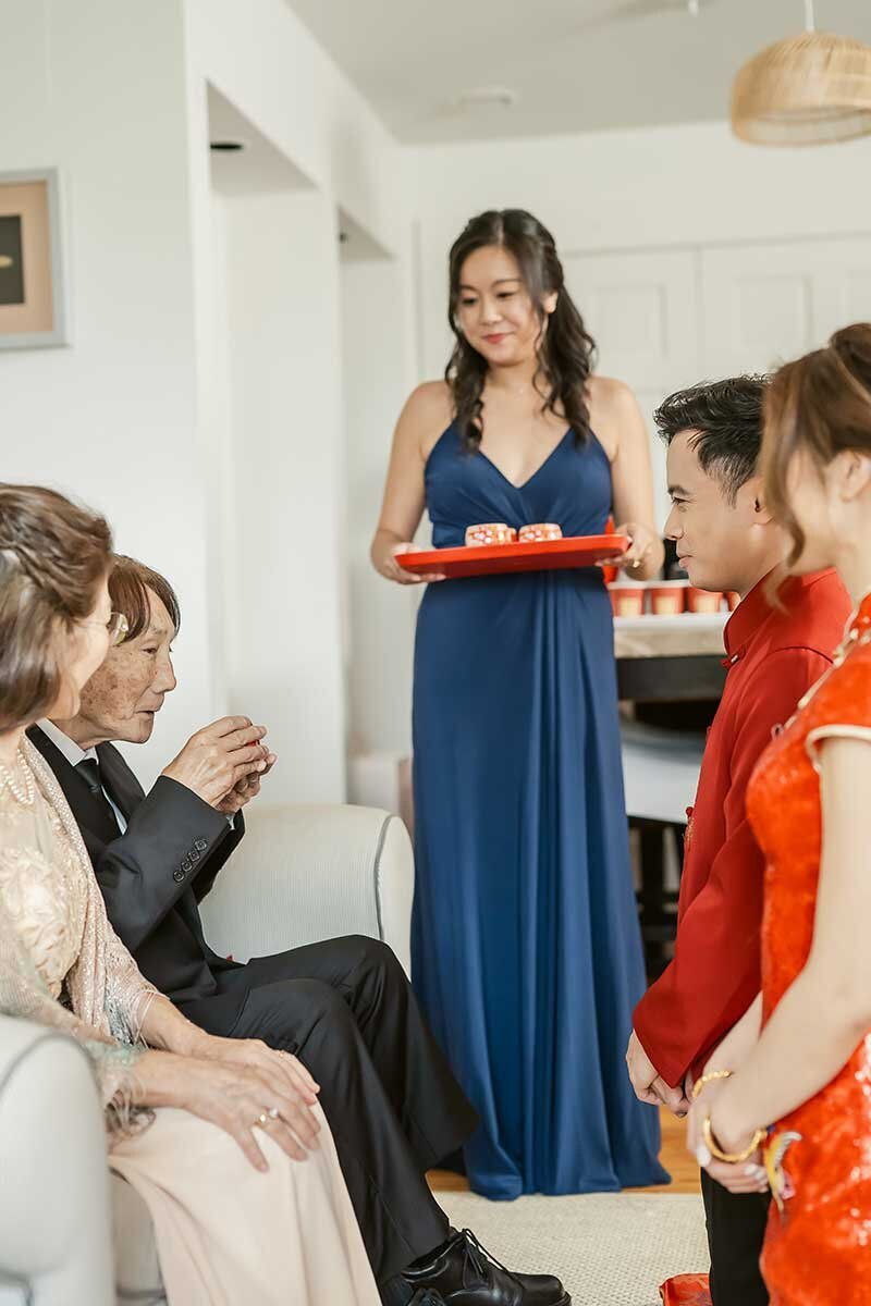 Family Serves Tea at Chinese Tea Ceremony Before Wedding