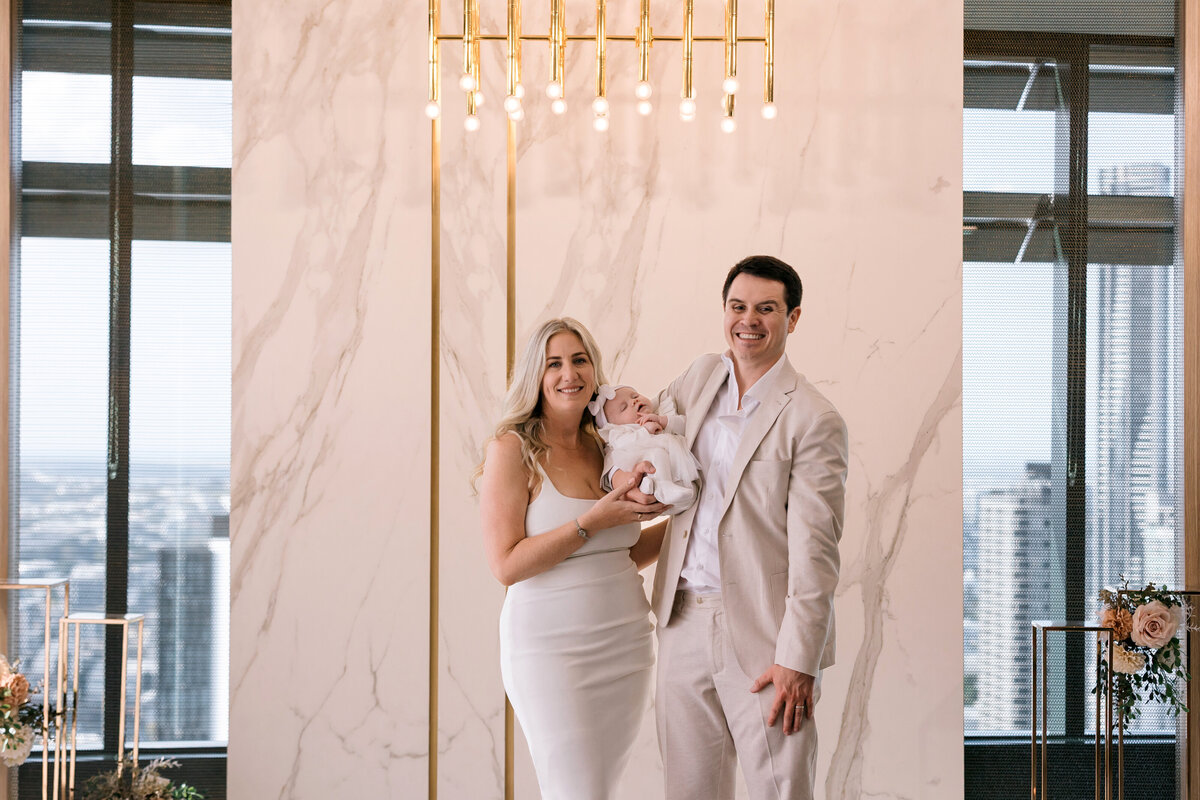 Bride and groom at the Brisbane registry office with their newborn daughter 