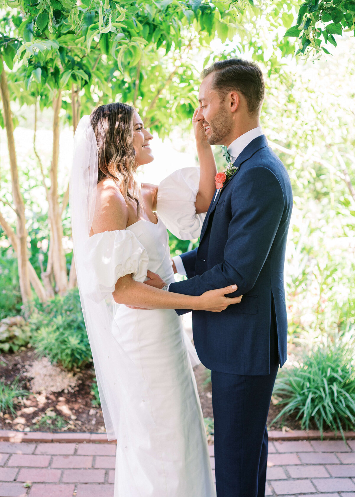 Bride and Groom wipe away tears during their first look in an image taken by Virginia Wedding Photographer