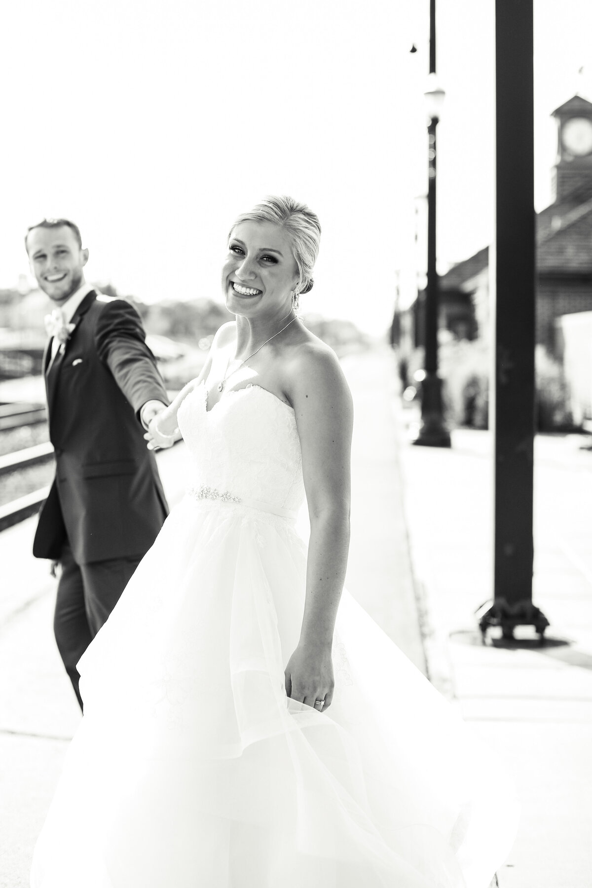 njeri-bishota-lauren-ashley-wedding-dress-bride-groom-train-station-black-and-white