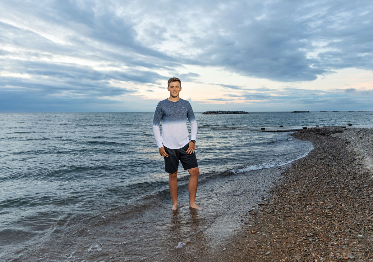 Senior portrait of a boy on Lake Erie at Presque Isle State Park