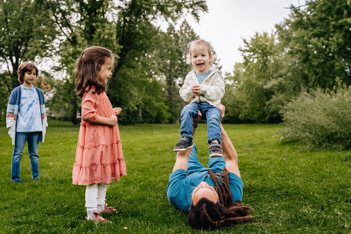 Kids laugh and half fun with their parent.