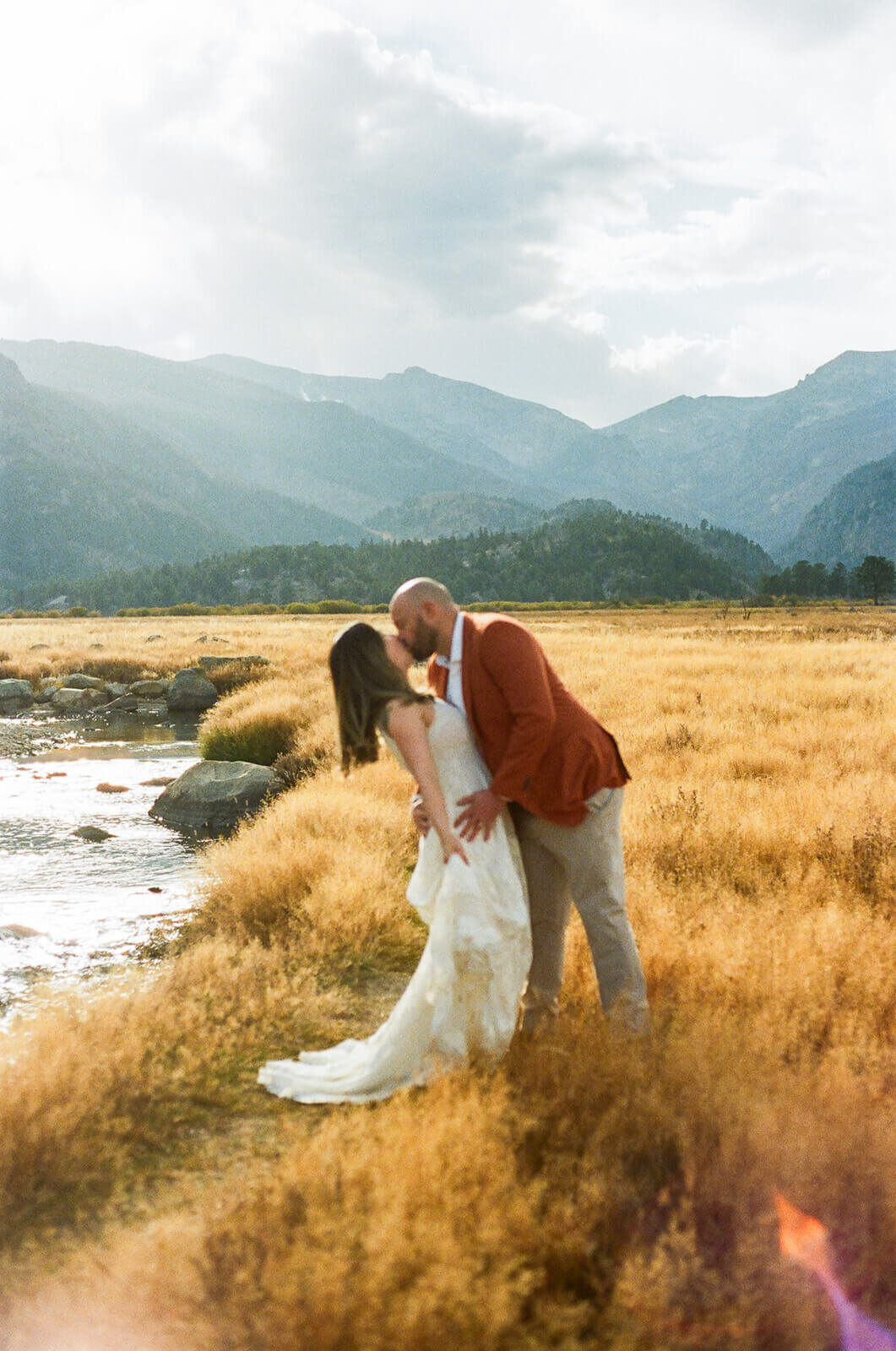 the rocky mountains are the backdrop to couples portraits