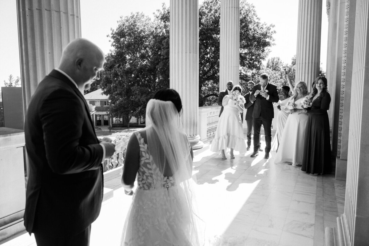 couple-with-wedding-party-cheering-them-on