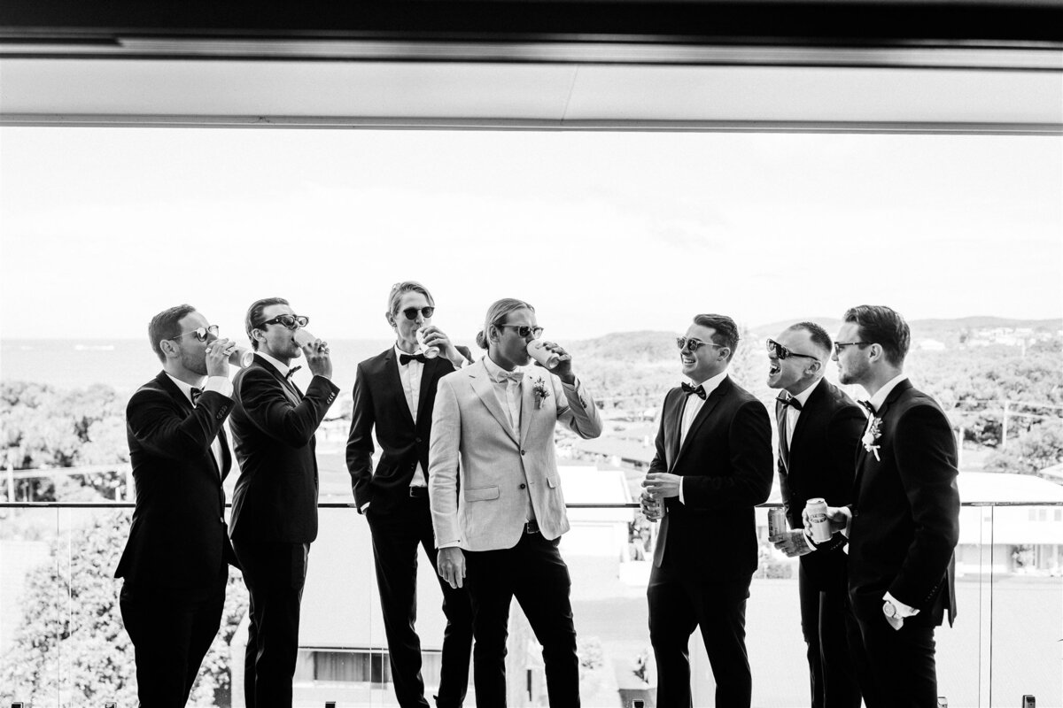 Luke together with his awesome groomsmen are having a fun photoshoot