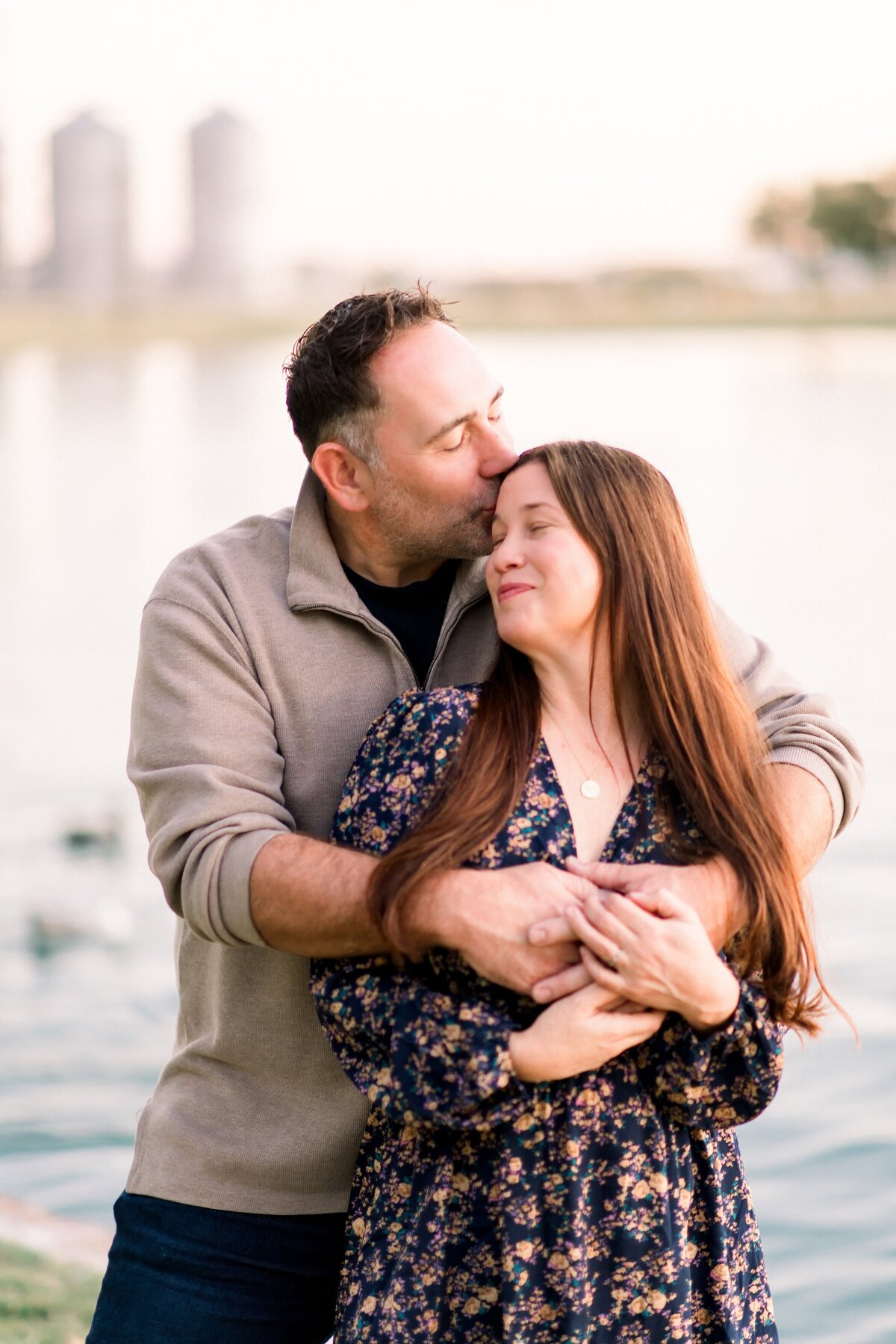 two parents holding onto each other by the gilbert silios