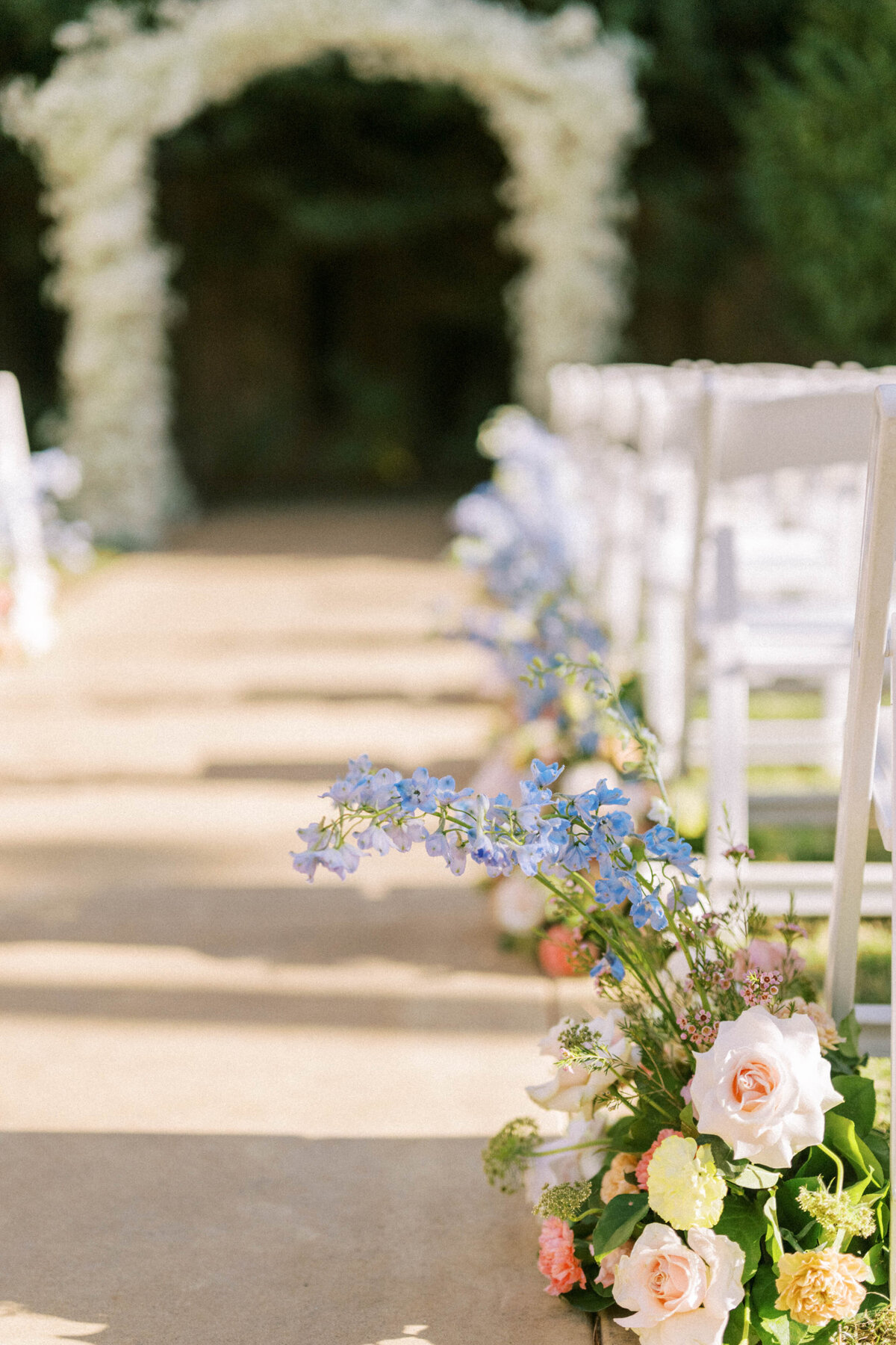 blue-flower-arrangements-line-aisle