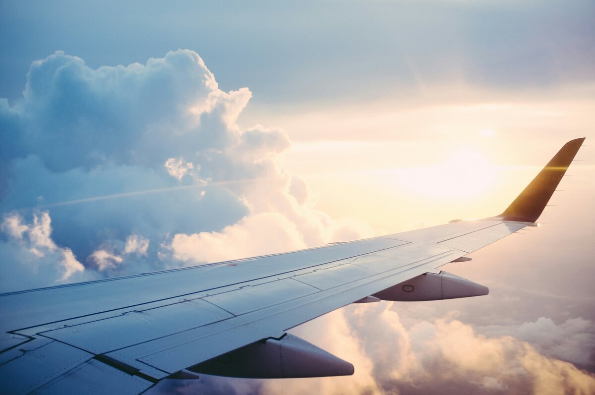 Plane wing in clouds