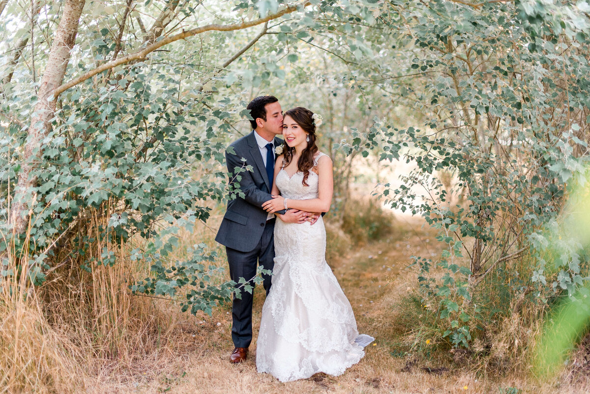 bride and groom in the forest at their vashon island wedding