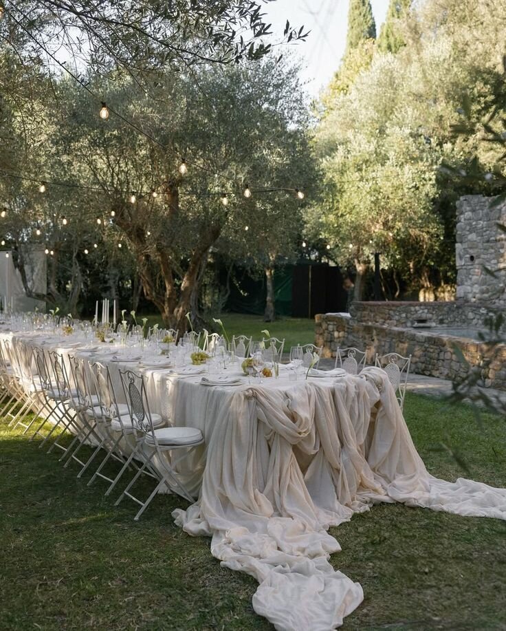 Romantic al fresco wedding table with flowing linens and organic textures, a design direction for Wrightsville Manor weddings
