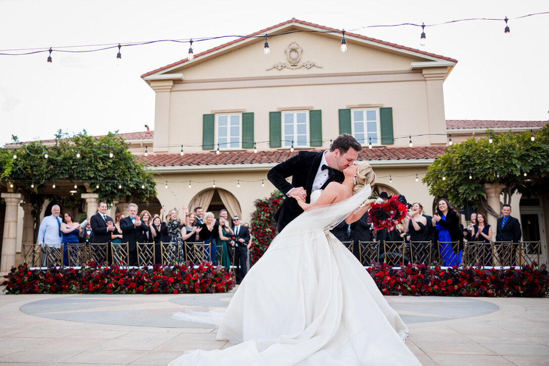 kiss and dip, beginning of aisle arrangements, ground arrangements, market lights, oblong bouquet, formal wedding, phantom of the opera theme, 
