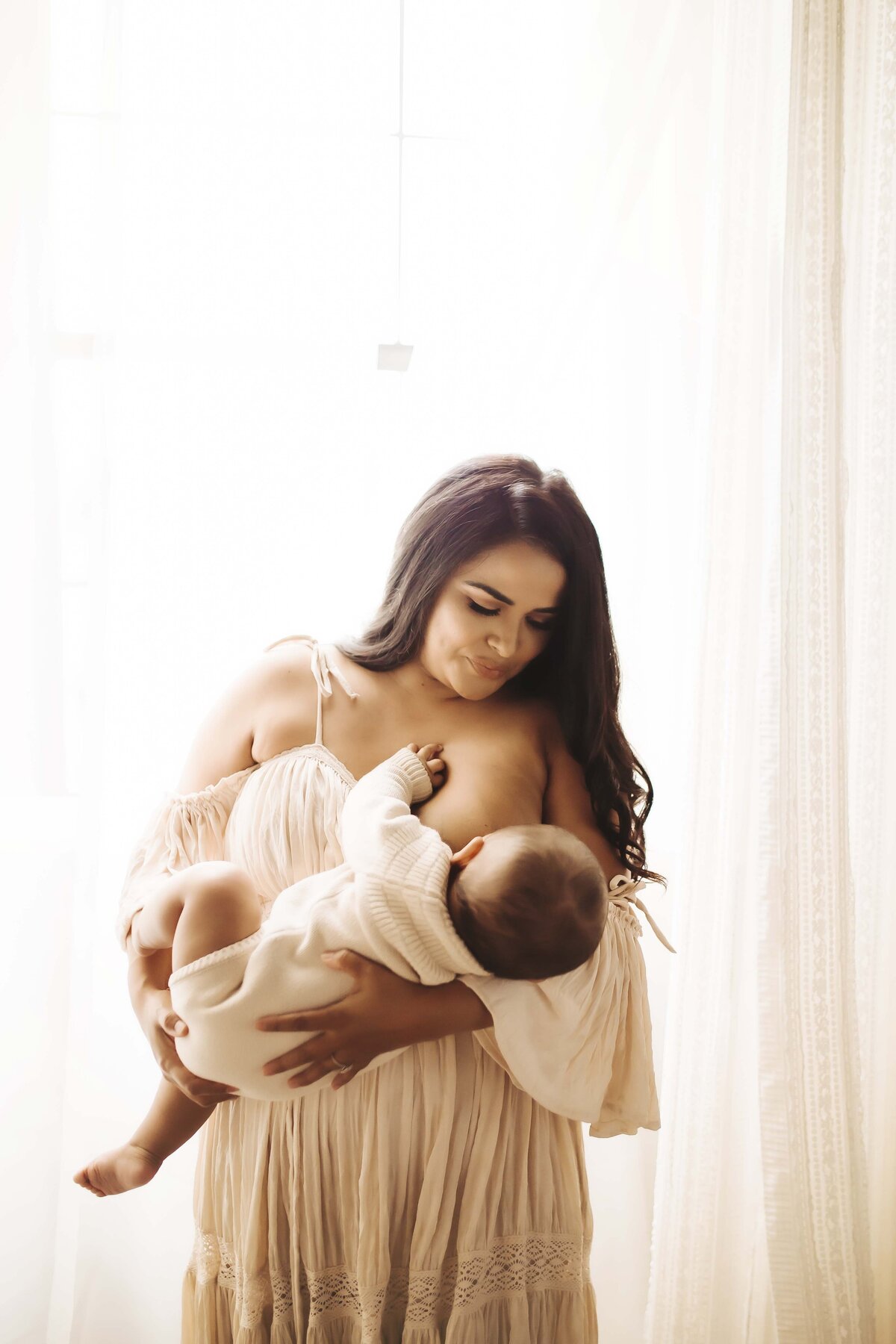 Studio motherhood session in Ozark Missouri with neutral and creamy tones