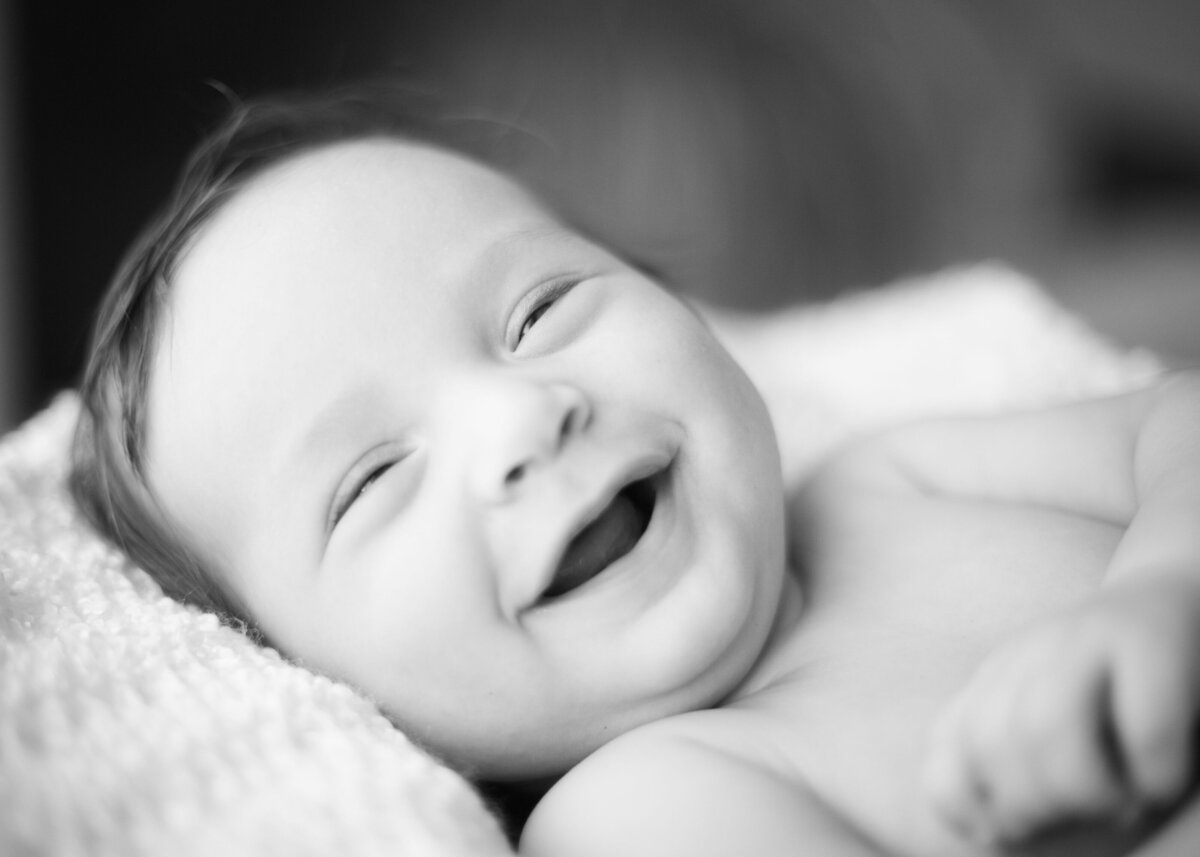 Baby smiling. Newborn photographer in East Texas, Quitman, Mineola, Sulpher Springs, Winnsboro, Tyler, Rockwall