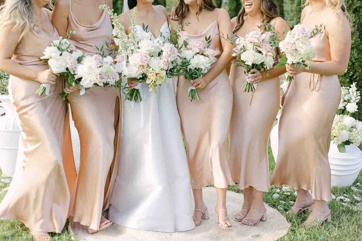 bride and bridesmaids dresses and bouquets