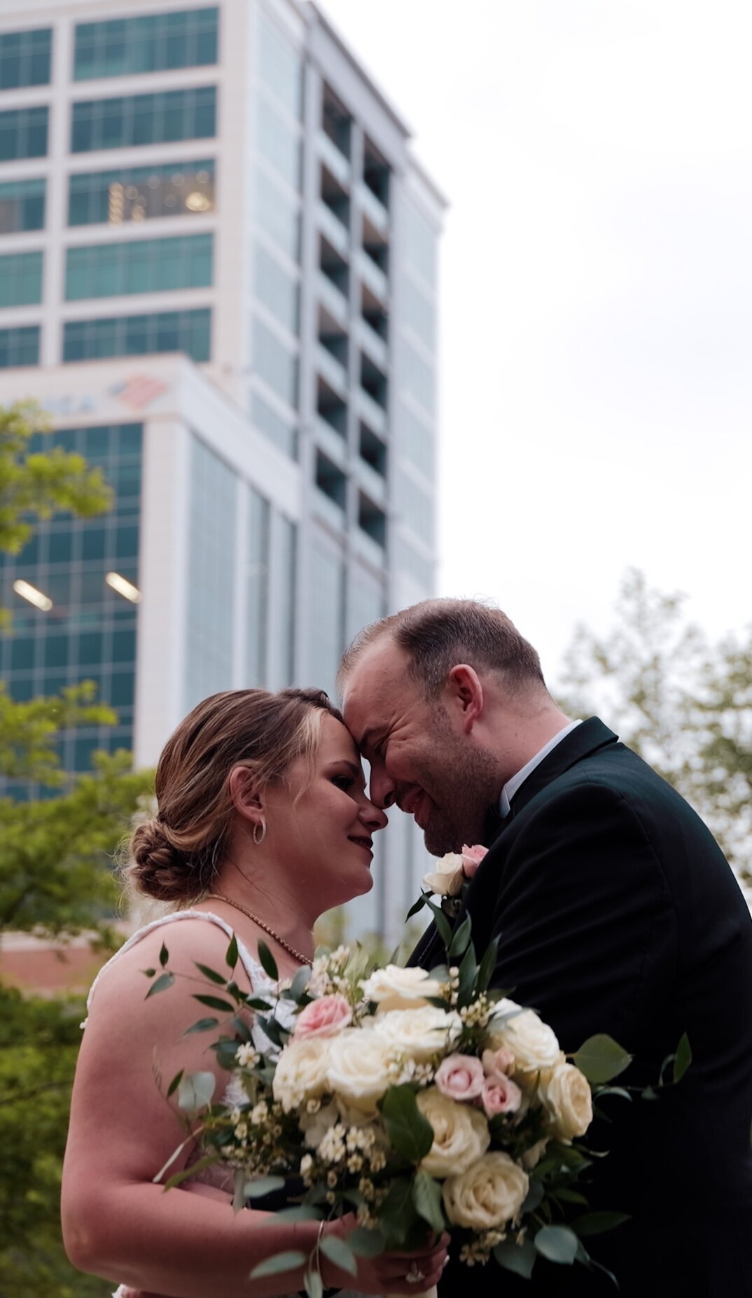 a newly wed couple in the middle of a city
