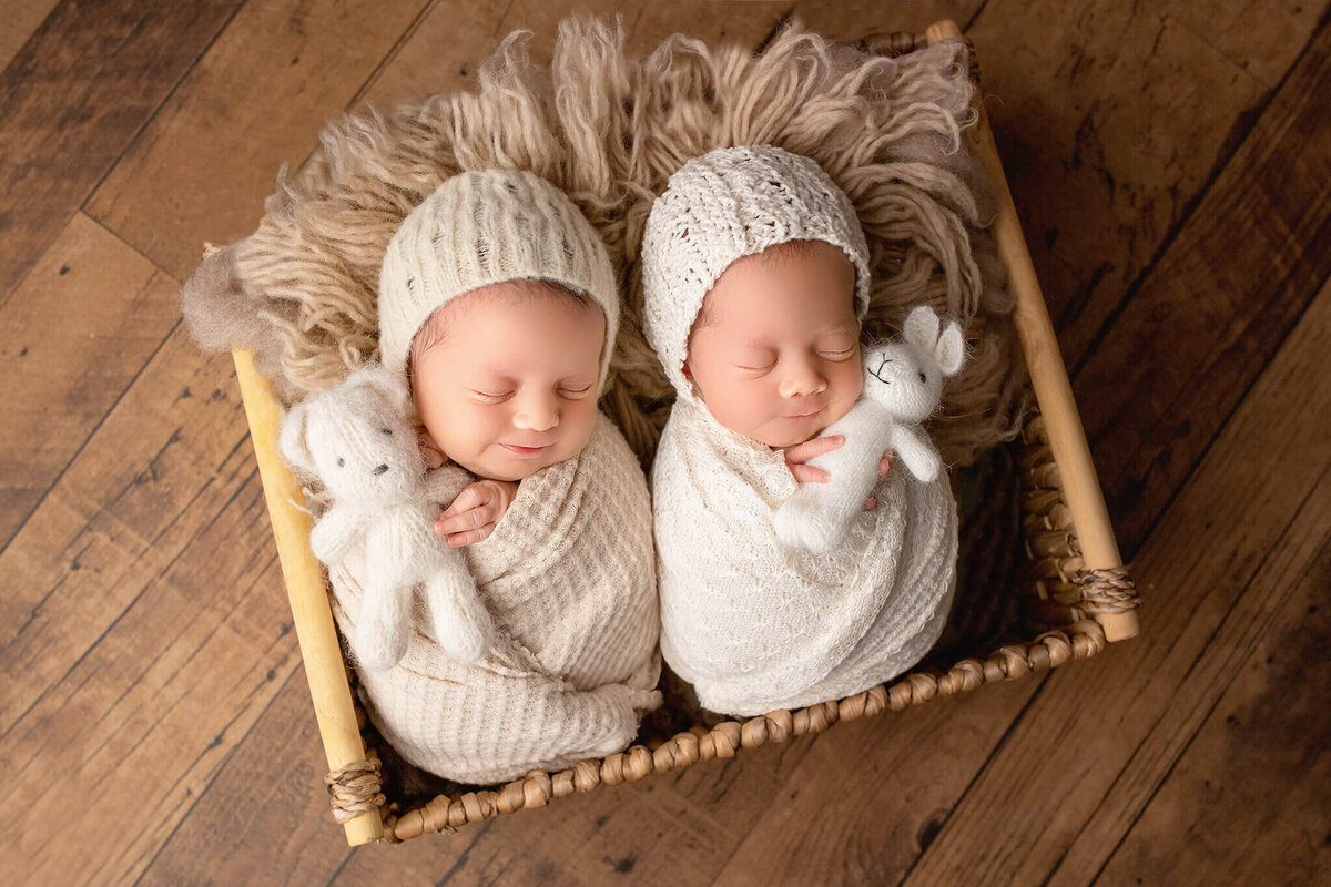 newborn twins smile during their session with hamilton newborn photographer