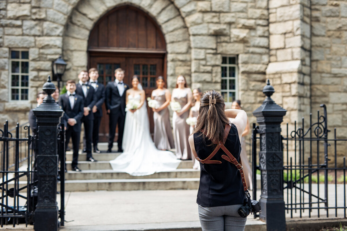 megan nicole photographing a wedding at Sacred Heart in downtown Raleigh