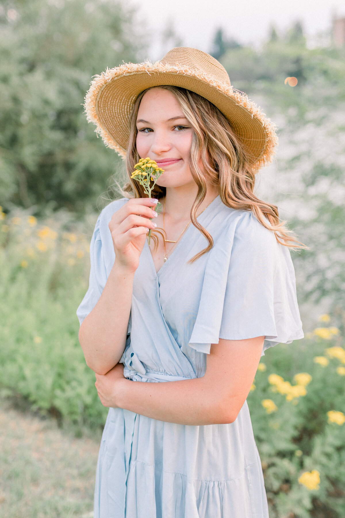 Austin Texas High school girl with casual outfit in the wildflowers for senior photos.