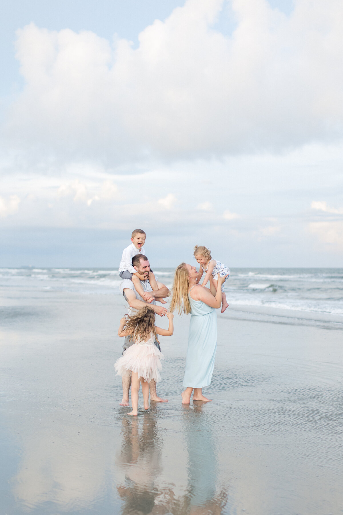 Family enjoys Folly Beach during portrait session with Karen Schanely