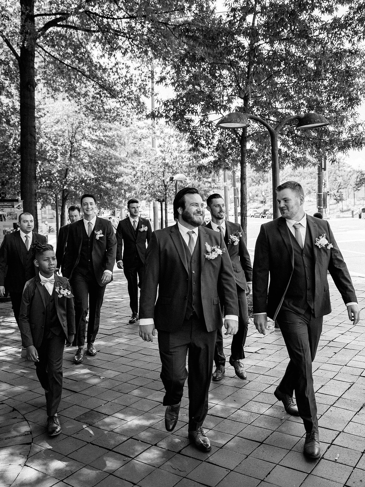 Wedding photo of groomsmen walking