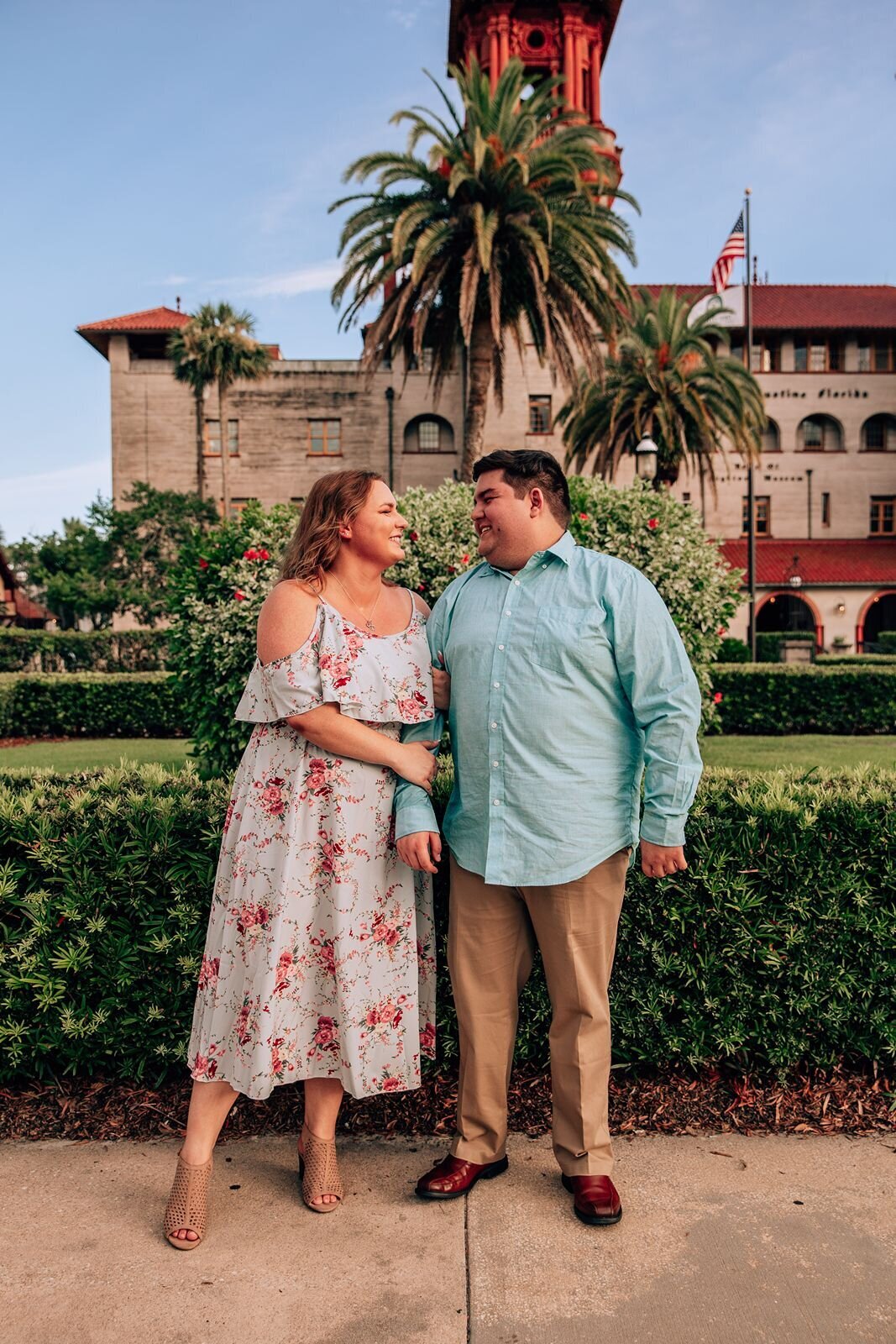 engaged couple standing in front of lightner museum in st. augustine florida