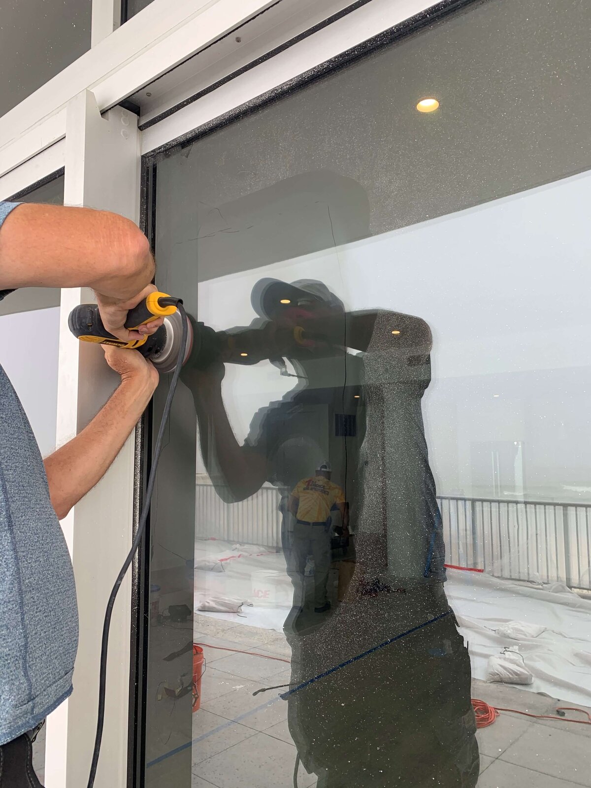 removing-scratches-in-glass-new-construction-perdido-key