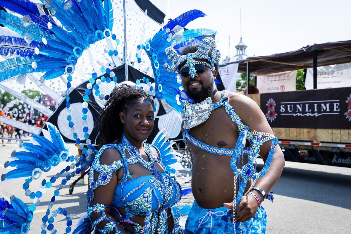 Toronto caribbean carnival parade masquerader in costume with Sunlime Mas, the number 1 medium size band at Toronto Carnival.