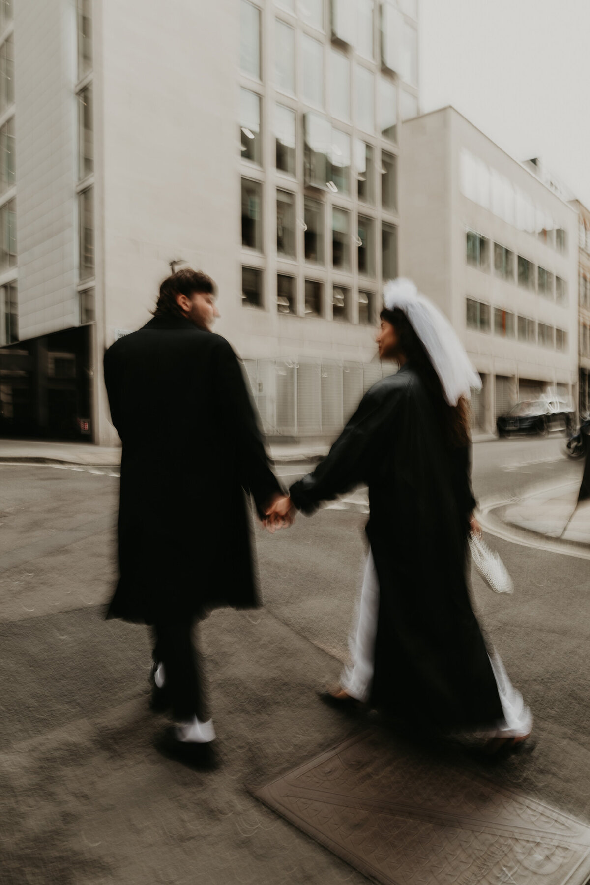 A married couple walk through the streets on London on their wedding day.