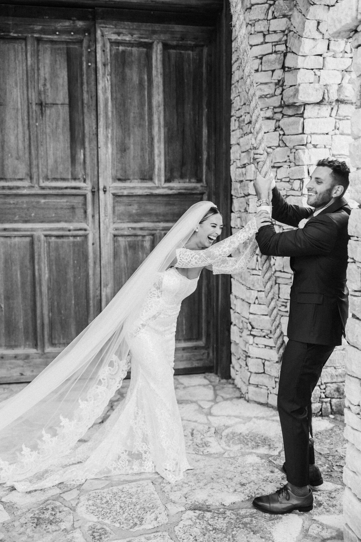 bride at groom ring bell at camp lucy