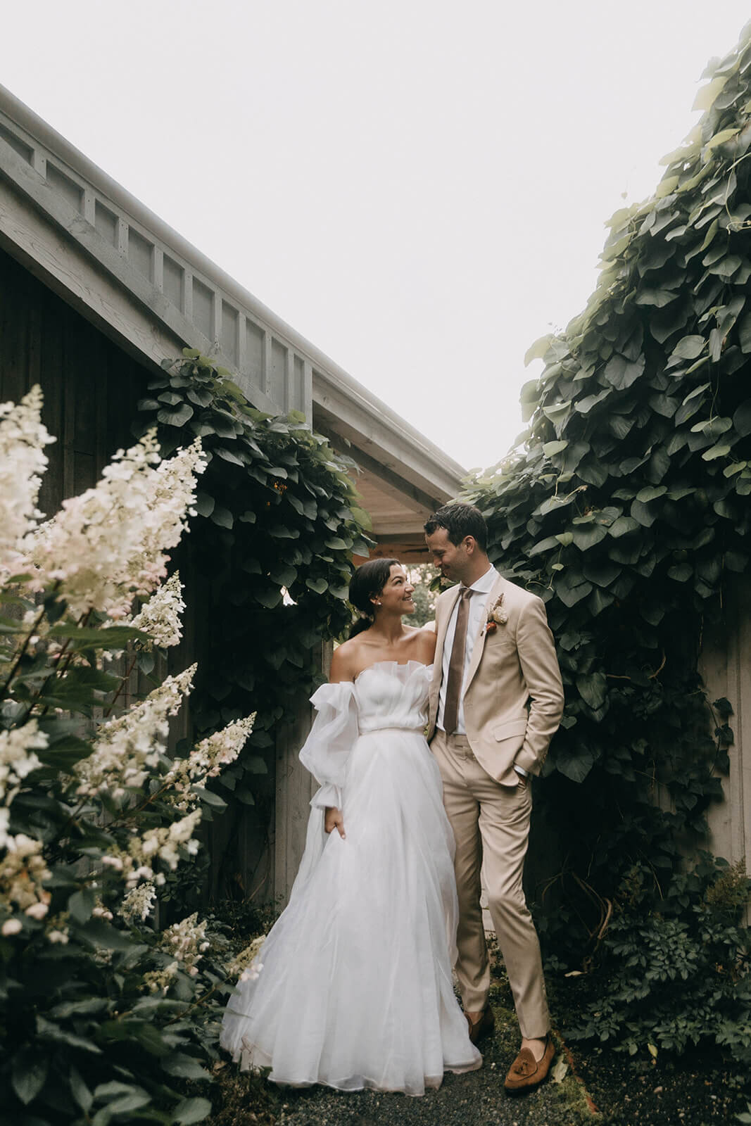 74.bride-and-groom-wedding-portrait-floral-cottage-greenery-background.