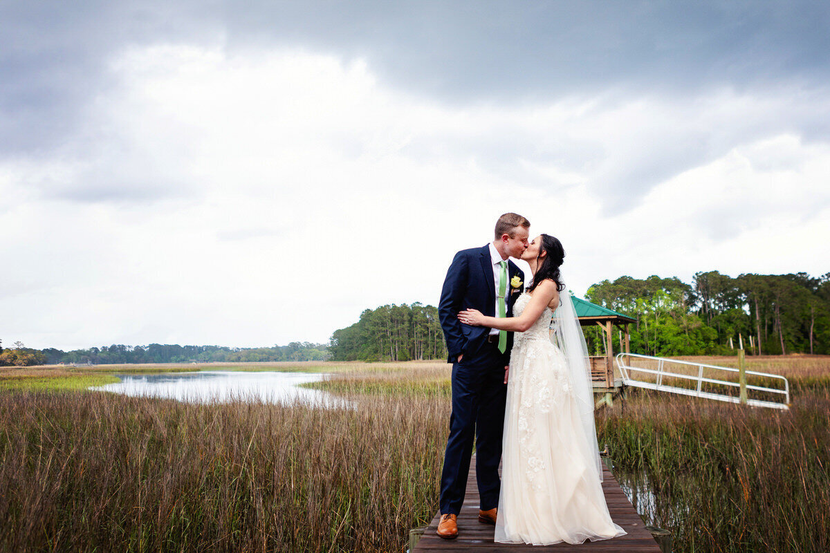 Bride and groom kiss on Wadmalaw Island Charleston Wedding Photographer